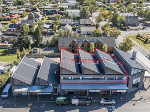 Fully tenanted commercial investment with apartment!