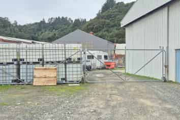 Workshop with gantry, warehouse, and secure yard.