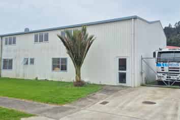 Workshop with gantry, warehouse, and secure yard.