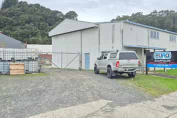 Workshop with gantry, warehouse, and secure yard.