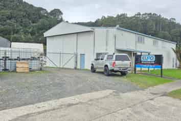 Workshop with gantry, warehouse, and secure yard.