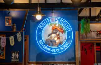 RUSSELL’S NAUTI PENGUIN BAR & RESTAURANT
