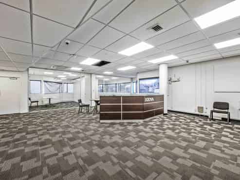 Versatile multi-use building with holding income