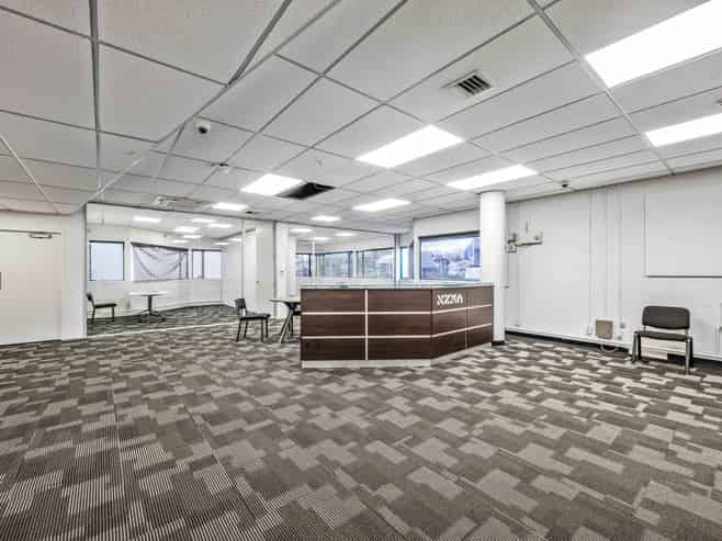 Versatile multi-use building with holding income