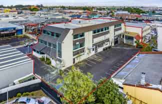 Versatile multi-use building with holding income