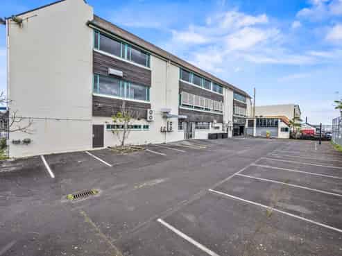 Versatile multi-use building with holding income