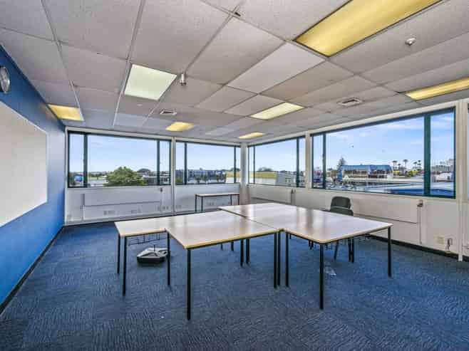 Versatile multi-use building with holding income