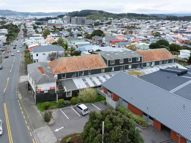 Prime development site with holding income