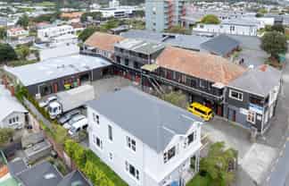 Prime development site with holding income