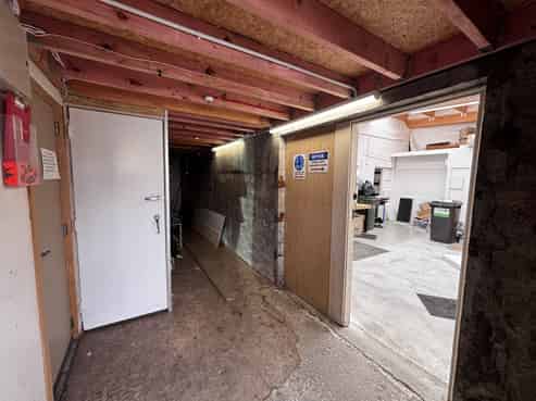 Bright ground floor storage or workshop with mezz