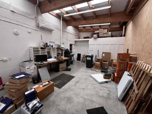 Bright ground floor storage or workshop with mezz