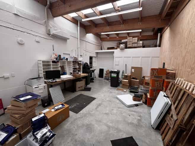 Bright ground floor storage or workshop with mezz