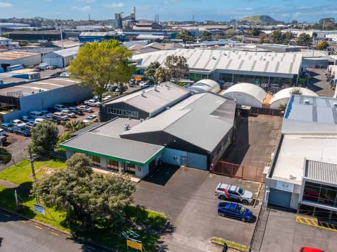 TWO WAREHOUSES, SHOWROOM, AND LARGE YARD
