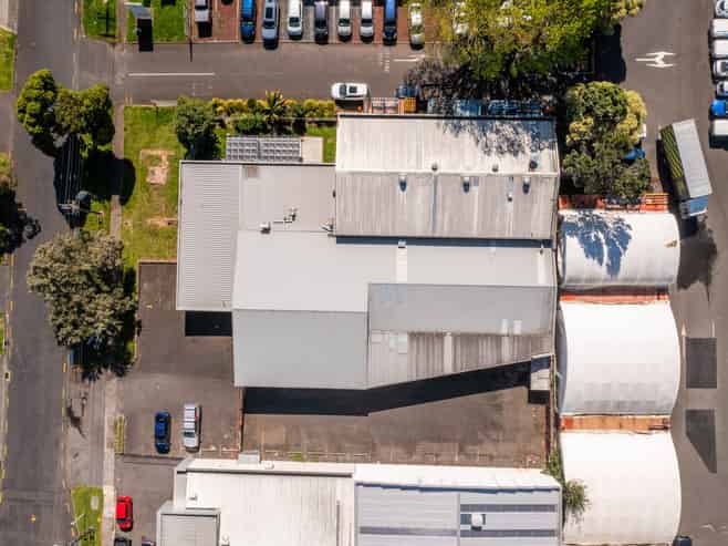 TWO WAREHOUSES, SHOWROOM, AND LARGE YARD
