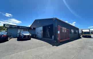 TWO WAREHOUSES, SHOWROOM, AND LARGE YARD
