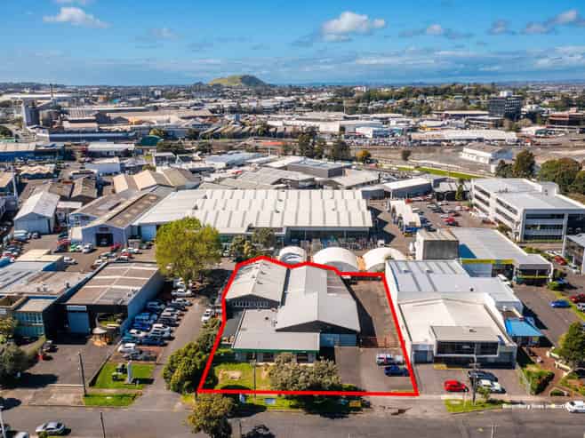 TWO WAREHOUSES, SHOWROOM, AND LARGE YARD
