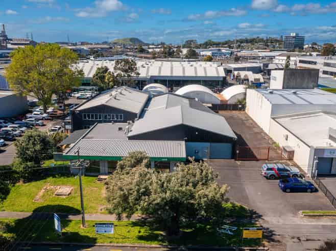 TWO WAREHOUSES, SHOWROOM, AND LARGE YARD

