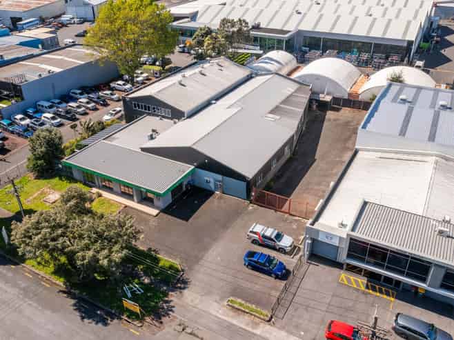 TWO WAREHOUSES, SHOWROOM, AND LARGE YARD
