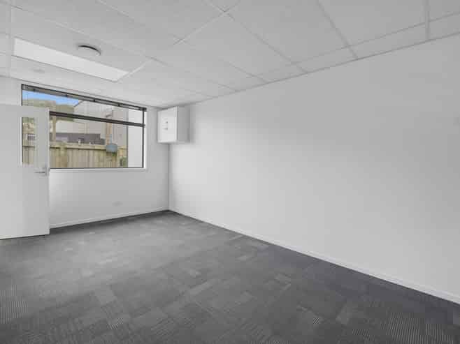 Tauriko building with 15 carparks
