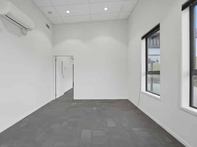 Tauriko building with 15 carparks