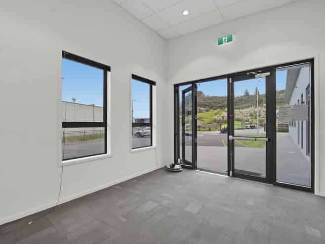 Tauriko building with 15 carparks