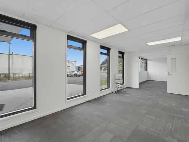Tauriko building with 15 carparks