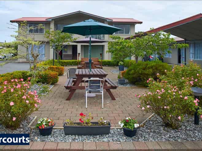 Be Charmed By This Motel Opportunity!