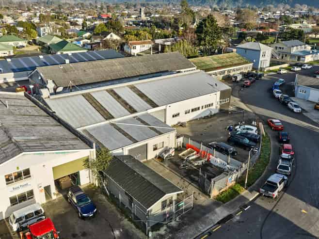 Vacant workshop with yard and parking