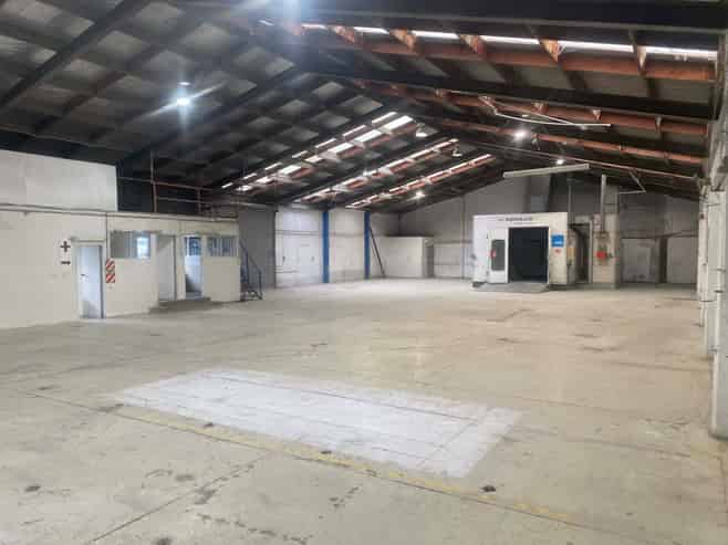 Vacant workshop with yard and parking