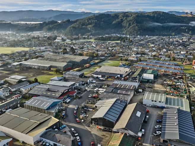 Vacant workshop with yard and parking