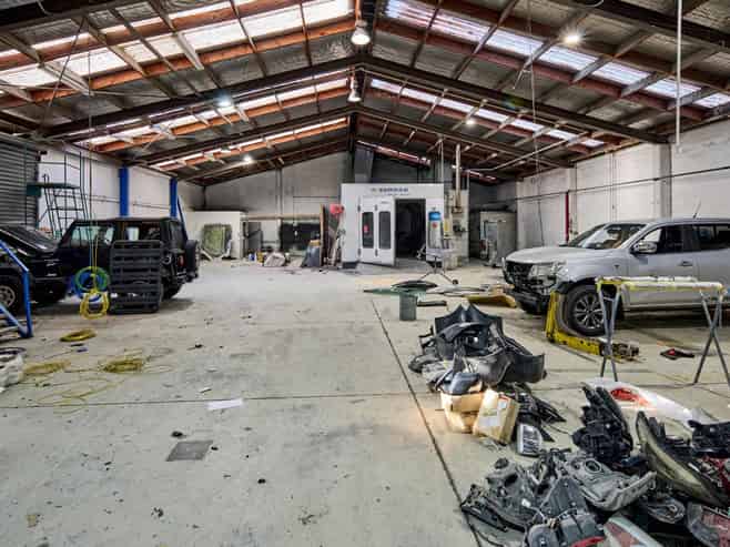 Vacant workshop with yard and parking