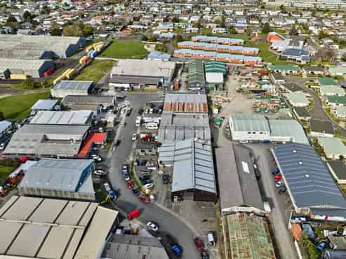 Vacant workshop with yard and parking
