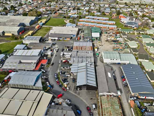 Vacant workshop with yard and parking