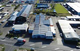 Industrial warehouse with crane and frontage