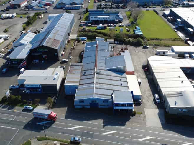 Industrial warehouse with crane and frontage