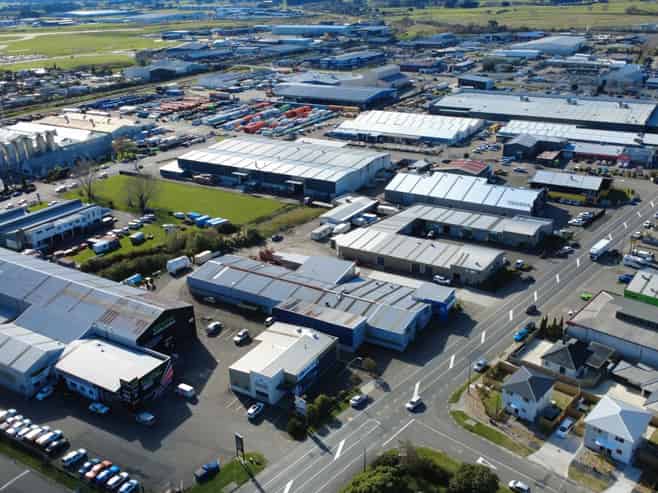 Industrial warehouse with crane and frontage