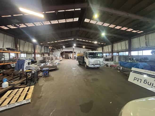 Industrial warehouse with crane and frontage