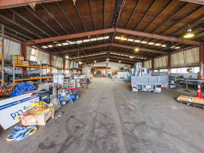 Industrial warehouse with crane and frontage