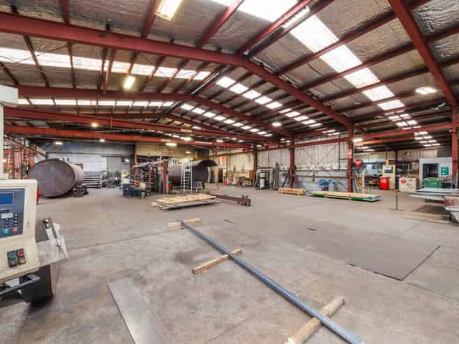 Industrial warehouse with crane and frontage